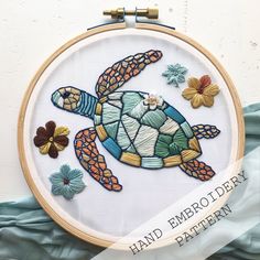 a close up of a cross stitch pattern with a sea turtle on it's back