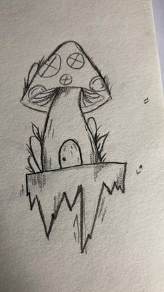 a drawing of a mushroom sitting on top of a piece of paper