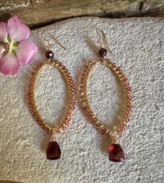 Gold filled hoop earrings with garnet gemstones Gold Teardrop Garnet Earrings, Gold Garnet Teardrop Earrings, Gold Hoop Jewelry With Gemstone Accents, Garnet Drop Earrings With Ear Wire, Gold Hoop Earrings With Gemstone Accents, Handmade Garnet Drop Earrings, Garnet Gemstone Drop Earrings, Garnet Briolette Beads For Jewelry Making, Gold Elegant Hoop Earrings With Gemstone Accents