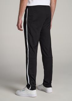 About Our Tall Men's Pants These men's tall athletic pants are a classic take on an athleisure essential. When it comes to athleisure, a good fit is key. You need something that's comfortable enough to relax in yet capable enough to work out in – but as a tall guy, it can be hard to find options that work for your height. You either have to compromise on a baggy fit or settle for lengths that are way too short. Not anymore. We know how hard it is to find quality styles when you're tall, which is Athleisure Essentials, Plus And Minus, Athletic Pants, Tall Guys, Baggy Fits, Athleisure, Mens Pants, Black Pants, Black Men