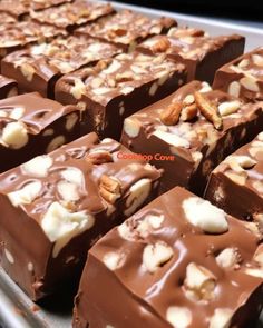 many pieces of chocolate with nuts on top