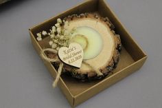 a wooden slice with a heart on it in a box