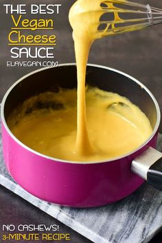 the best vegan cheese sauce is being poured into a pot