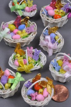 several small baskets filled with different colored candies