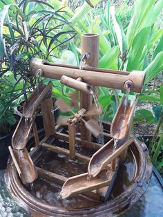 a fountain made out of wood and water