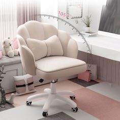 a white office chair sitting in front of a window