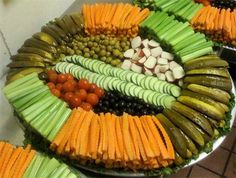 a platter filled with different types of vegetables