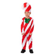 a little boy dressed in a red and white striped costume