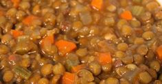 a bowl filled with cooked beans and carrots