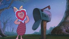 a cartoon character holding a heart in front of a mailbox with the letter q on it