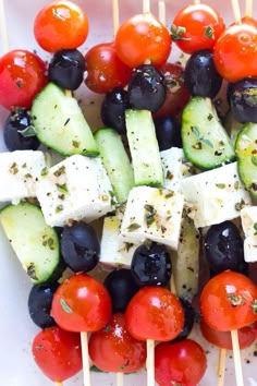 the skewers are filled with different types of vegetables and cucumber slices