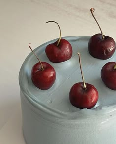 there are cherries on top of the cake