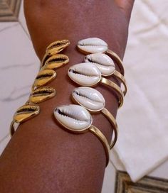 This bracelets and rings are handcrafted with brass. Listing for five bracelets For more bracelets click the link below https://www.etsy.com/listing/929226883/african-handmade-beaded-bangles?ref=shop_home_active_19 Dhl shipping express Thank you. Metal Bangle Bracelets For Beach, Beach Bangle Bracelets In Metal, Gold Brass Bracelets For The Beach, Gold Brass Bracelet For The Beach, Handmade Brass Bracelets For Beach, African Bangles, Bracelets Custom, African Jewellery, Beaded Bangles