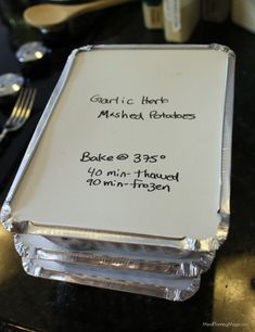 a close up of a menu on a table with silverware and utensils