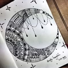 a drawing of a crescent with rain drops on it