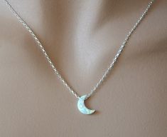 Shop Moon Phase Necklace. You can wear this dainty opal necklace with any style/color of your dress. This layering necklace is made from: - Lab created white opal moon bead- 11 mm x 8 mm - Diamond cut sparkling sterling silver chain - Sterling silver lobster clasp - Sterling silver jump ring Please select a desired length from the drop-down menu. Opal jewelry will make a great gift! Opal is October birthstone. Your order of celestial jewelry will be mailed within 2 business days, nicely packaged Mystical Moon Shaped White Necklace, Celestial Silver Opal Jewelry, Celestial Silver Moonstone Necklace, Elegant White Moon-shaped Necklace, Celestial Silver Opal Necklace, Opal Necklaces, Dainty Opal Necklace, Opal Moon Necklace, Opal Necklace Silver