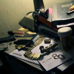 the desk is cluttered with various items such as pens, scissors and other office supplies