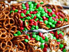 a bowl filled with cereal and pretzels on top of rice krispy kreme