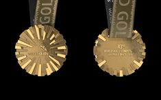 two gold medals with black background and white lettering on each medal is the same color as it appears in this image