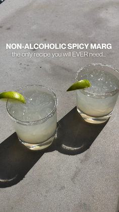 margaritas on a concrete background with the text "non-alcoholic spicy margarita: the only recipe you will ever need" Spicy Non Alcoholic Drinks, Non Alcoholic Margarita Recipe, Spicy Margarita Mocktail, Cocktail Non Alcoholic, Cocktails Non Alcoholic, Clean Cocktails, Spicy Margarita Recipe, Spicy Margarita