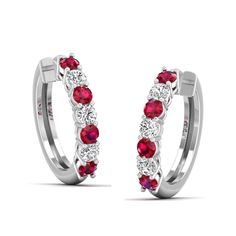 Introducing our exquisite ruby and diamond hoop earrings. These stunning earrings are the perfect blend of elegance and sophistication, making them a timeless addition to any jewelry collection. The vibrant red rubies and sparkling diamonds are meticulously set in a hoop design, creating a captivating and eye-catching piece. Metal: 14K Gold Setting Type: Prong Rhodium Finish: Yes, on White Gold Gemstone Details: Gemstone: Ruby Shape: Round Average Dimensions: 2.50 MM Quantity: 08 Average Cut: Ve Dance Jewelry, Hoop Design, Birthstone Gifts, Ring Pendant Necklace, Diamond Hoop Earrings, Stunning Earrings, Sparkle Diamonds, Mens Wedding Bands, Bridal Rings