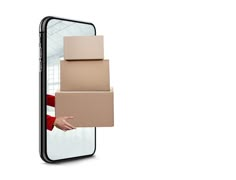 a person is holding boxes in front of their phone