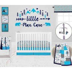 a baby's nursery room with blue and white bedding, wall decals, and crib