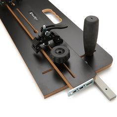 a close up of a snowboard with skis and poles attached to the board