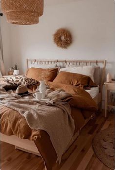 a bed sitting in a bedroom next to a wooden floor