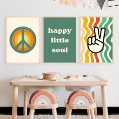 two posters on the wall above a table with chairs in front of it and peace sign