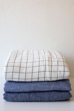 three blankets stacked on top of each other