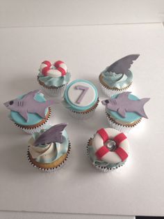 cupcakes decorated with different types of sea animals