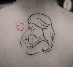 a woman with a tattoo on her back holding a baby in her arms and a heart