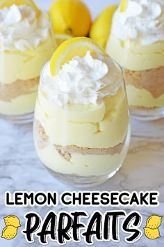 lemon cheesecake parfaits in small glasses on a marble table with lemons