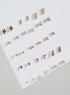 FIT Mini stud silhouette. MATERIALS + CARE Base metal. Imported. DETAILS High shine finish. . Set of 15 pairs. Various Holiday charms. The best plus size women's mini holiday earring stud pack earrings in gold. Torrid is your destination for cozy fall and winter clothes to keep you warm and comfortable. Mini Studs, Types Of Jewelry, Body Chains, Earring Stud, Holiday Earring, Earrings In Gold, Stud Earrings For Women, Jewelry To Make, Cozy Fall