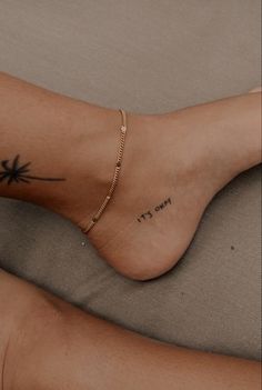 a woman's foot with a tattoo on it