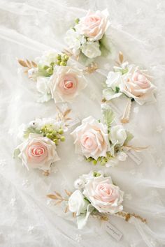 pink and white flowers are arranged in the shape of a heart