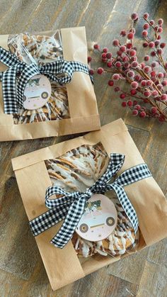 two boxes with cookies in them on a table