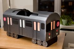 a toy train sitting on top of a wooden table