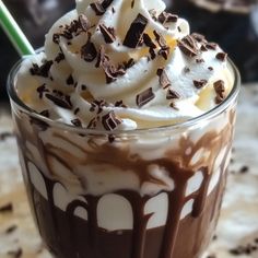 there is a chocolate milkshake with whipped cream on top