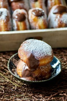 chocolate covered donuts stacked on top of each other