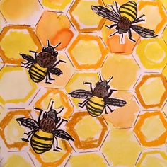 three bees sitting on top of honeycombs painted in yellow and orange colors with brown spots