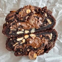 two chocolate brownies with nuts on top