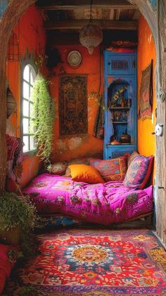 a bedroom with an archway leading into the room and colorful rugs on the floor