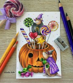 a drawing of a halloween pumpkin with candy and candies in it next to some colored pencils