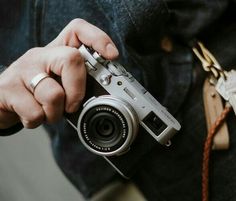 a person holding a camera in their hand