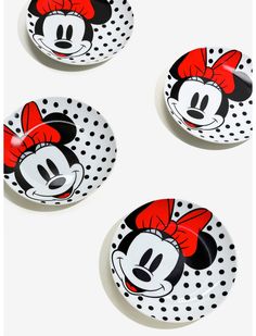 three mickey mouse plates with polka dot designs on the front and back, one has a red bow