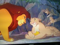 the lion and the mouse are playing together in front of a screen with other cartoon characters