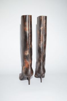 Acne Studios multi brown boots are crafted from leather with a painted finish, debossed logo on the top side. Detailed with a pointed toe and thin heel. Fall Shoes 2024, Under The Knee Boots, Leather Heel Boots, Mini Boots, Winter Lookbook, Debossed Logo, Leather Heeled Boots, Au Naturale, Boots Heels