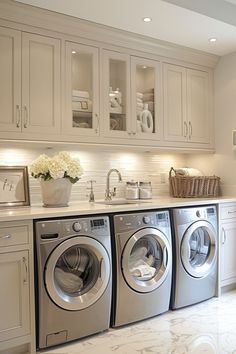 a washer and dryer in a white kitchen